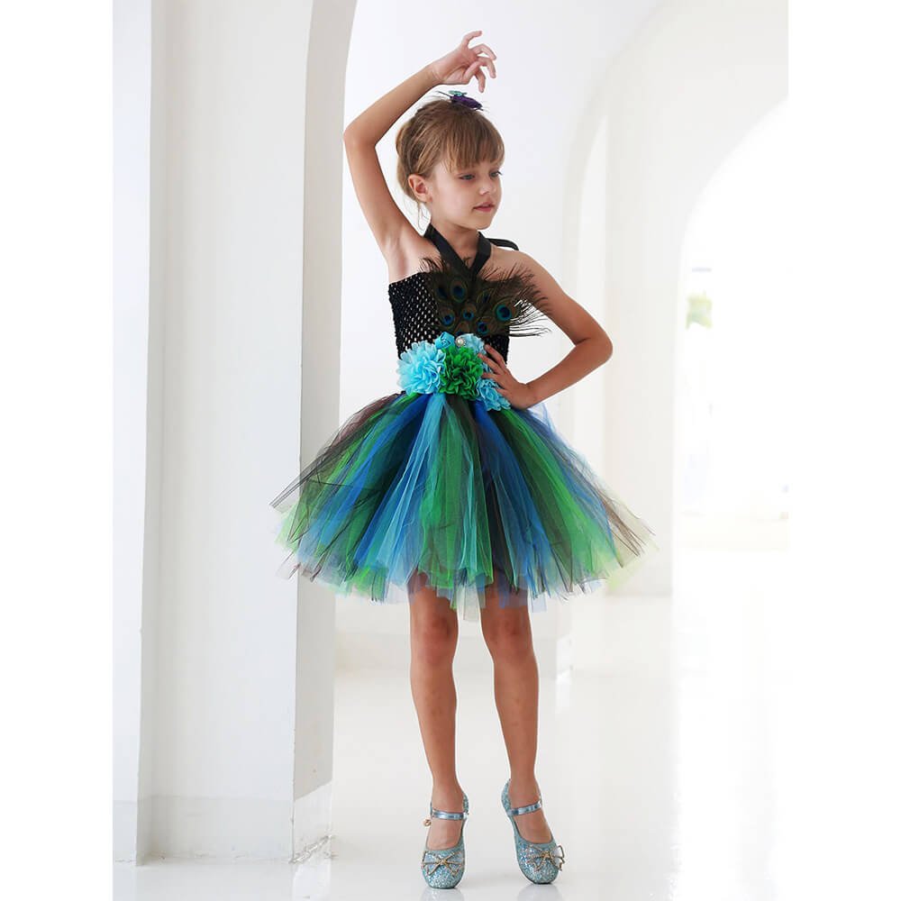 Babelio girl in peacock-inspired tutu dress posing in a bright hallway