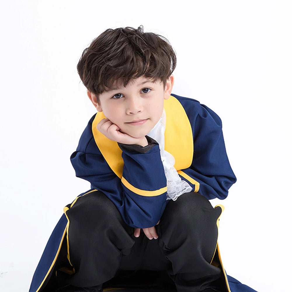 Babelio boy in blue and yellow prince costume posing against a white background