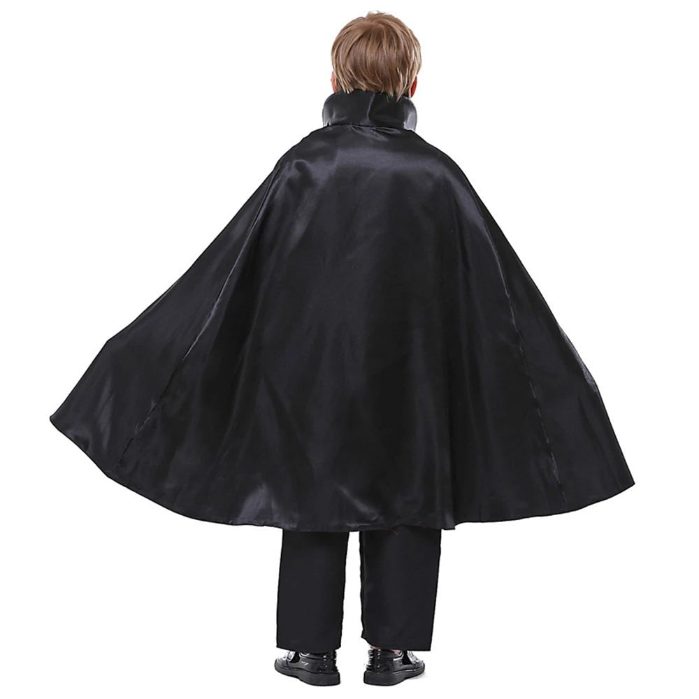 Babelio boy in black Halloween vampire cape costume, full length, plain background