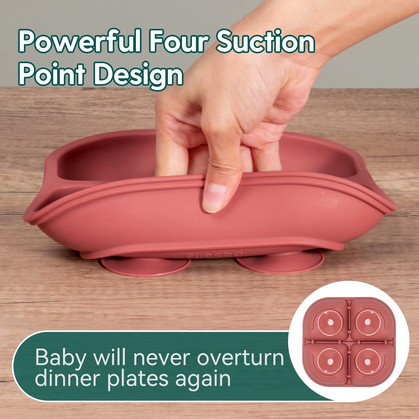 Babelio pink silicone baby suction plate with four suction cups on wood table, hand pressing down